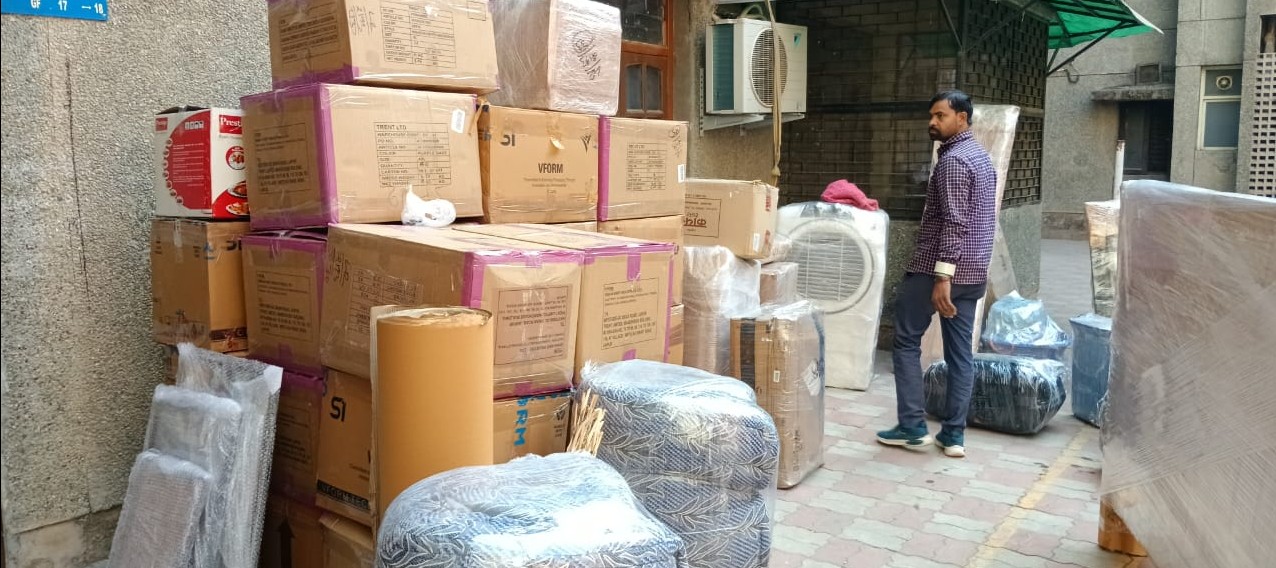 Expert packing of household goods using premium packing materials by Trusted Packers and Movers.